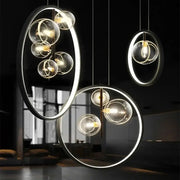 Modern black glass bubble chandelier featuring pendant lights with glowing led rings and clear glass spheres for dining room decorbites glass bubble