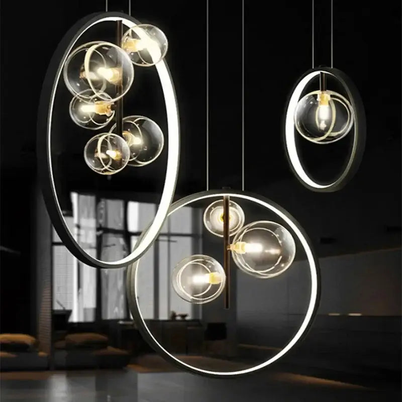 Modern black glass bubble chandelier featuring pendant lights with glowing led rings and clear glass spheres for dining room decorbites glass bubble