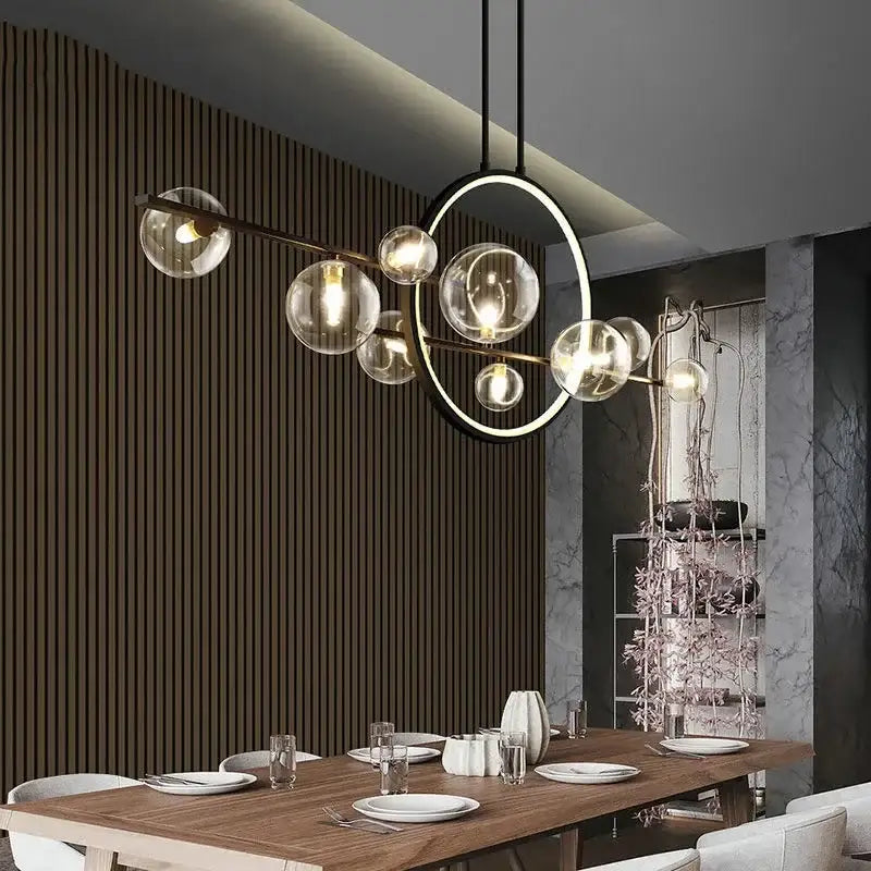 Modern black glass bubble chandelier with brass frame and circular accent ring for dining room decorbites glass bubble