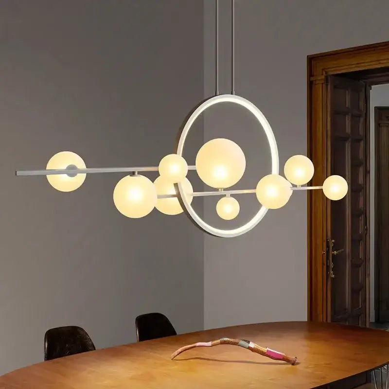 Modern black glass bubble chandelier featuring a white metal frame with frosted glass spheres for dining room decorbites glass bubble