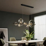 Modern black metal decorbites glass bubble chandelier with clear globe bulbs and circular accent ring for dining room light