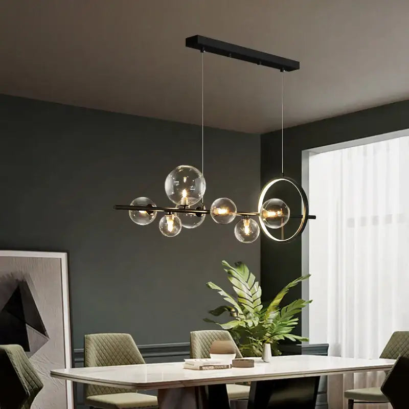 Modern black metal decorbites glass bubble chandelier with clear globe bulbs and circular accent ring for dining room light