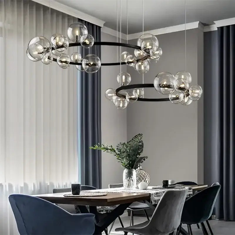 Modern black metal chandelier with clear glass globe bulbs designed as a decorbites glass bubble led ceiling fixture