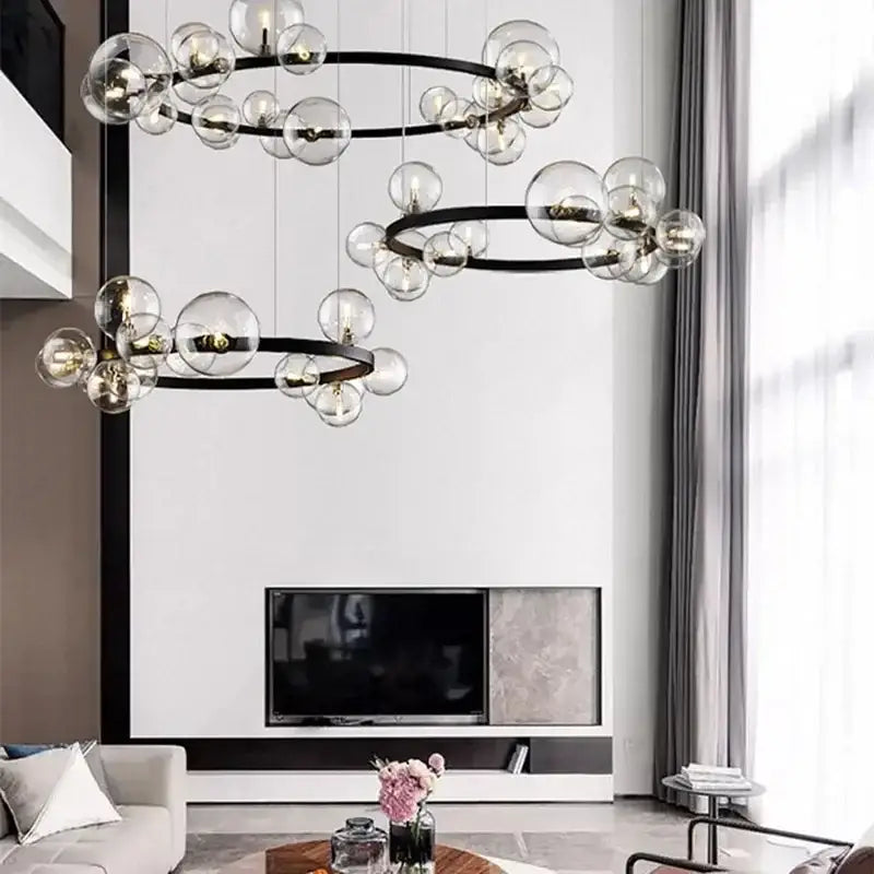 Modern black metal chandelier with clear glass bubble led bulbs arranged in circular clusters for dining room decorbites glass bubble