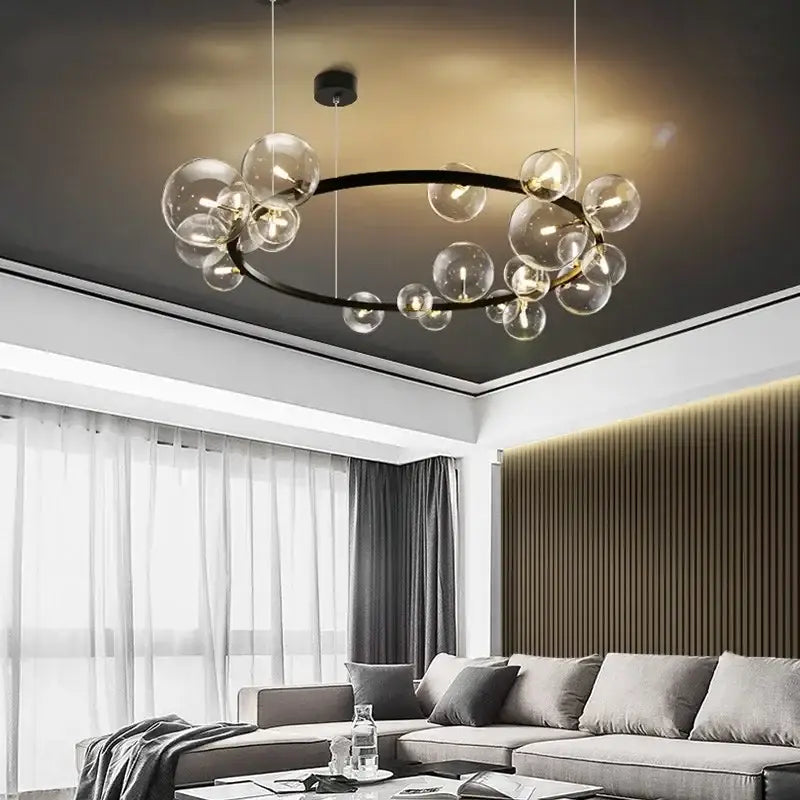 Modern black glass bubble led ceiling chandelier with sleek circular frame and warm golden lighting for dining room decorbites glass bubble