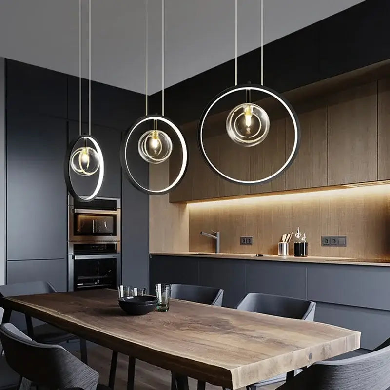 Modern black glass bubble led chandelier featuring minimalist black and clear glass rings with warm bulbs for dining room decorbites glass bubble
