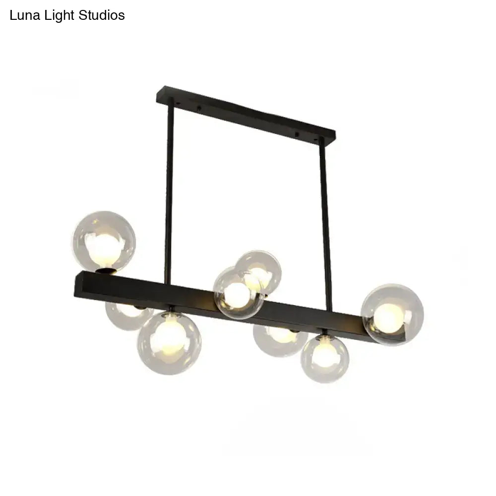 Modern black metal chandelier with clear glass globe bulbs designed for dining room and kitchen island lighting