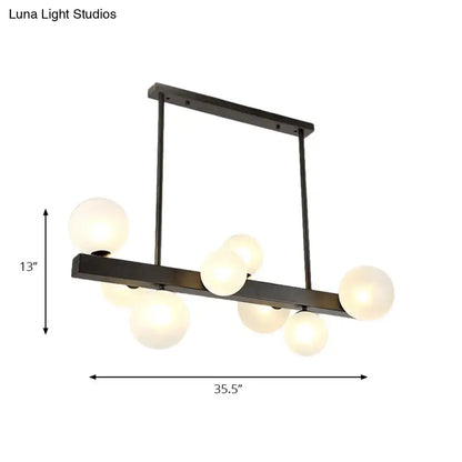 Modern black metal chandelier with six frosted glass globe bulbs ideal for dining room lighting by DecorBites™