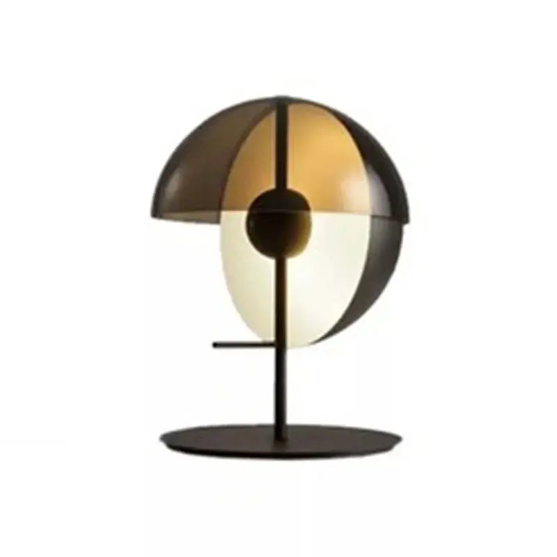 Modern black glass designer bedside lamp with a split dome shade featuring translucent amber and white sections for decorbites bedside lamp decor