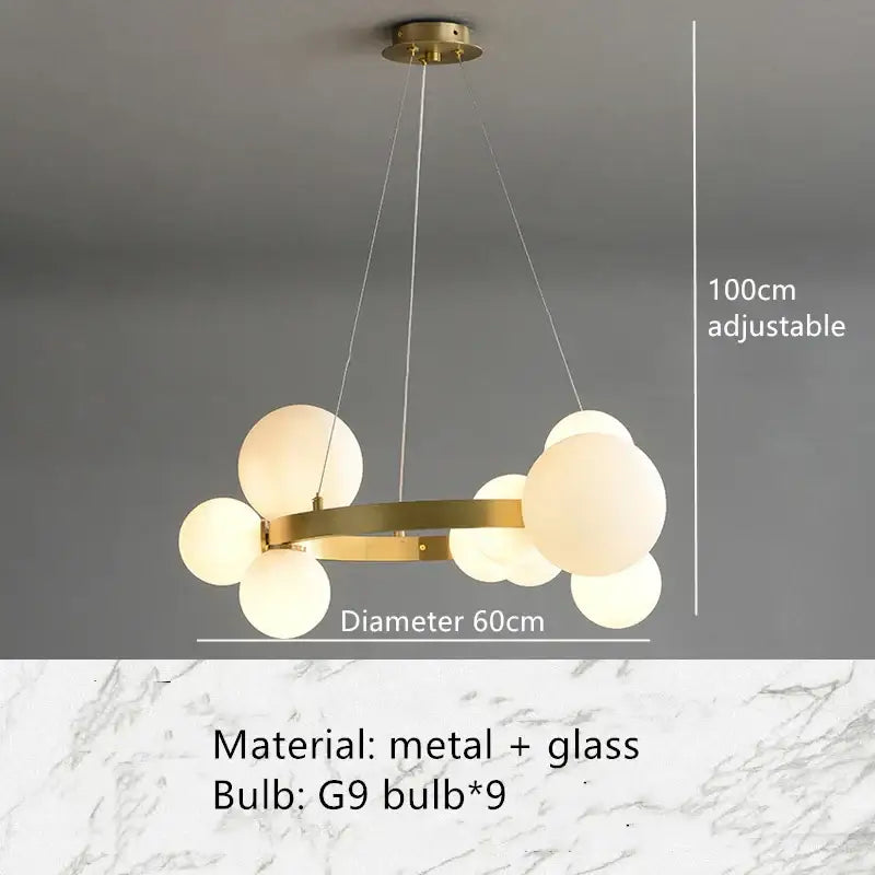 Modern gold-toned metal pendant light fixture with frosted glass globe bulbs in a circular cluster design for dining room
