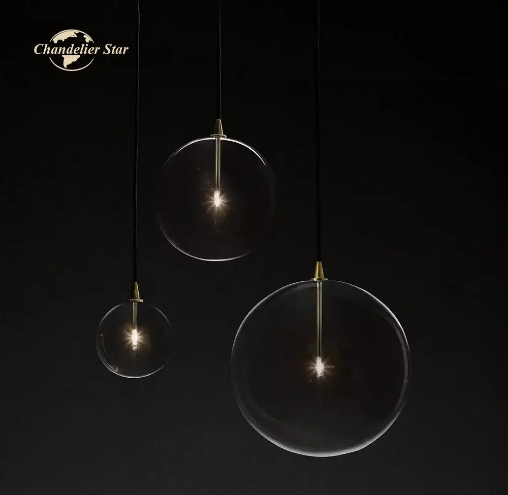 Modern black glass globe pendant light with clear spherical glass globe and brass accents for dining room decorbites glass globe