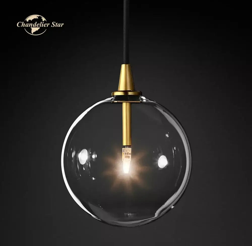 Modern black glass globe pendant light with clear glass globe and gold-toned metal fixture for dining room decorbites glass globe