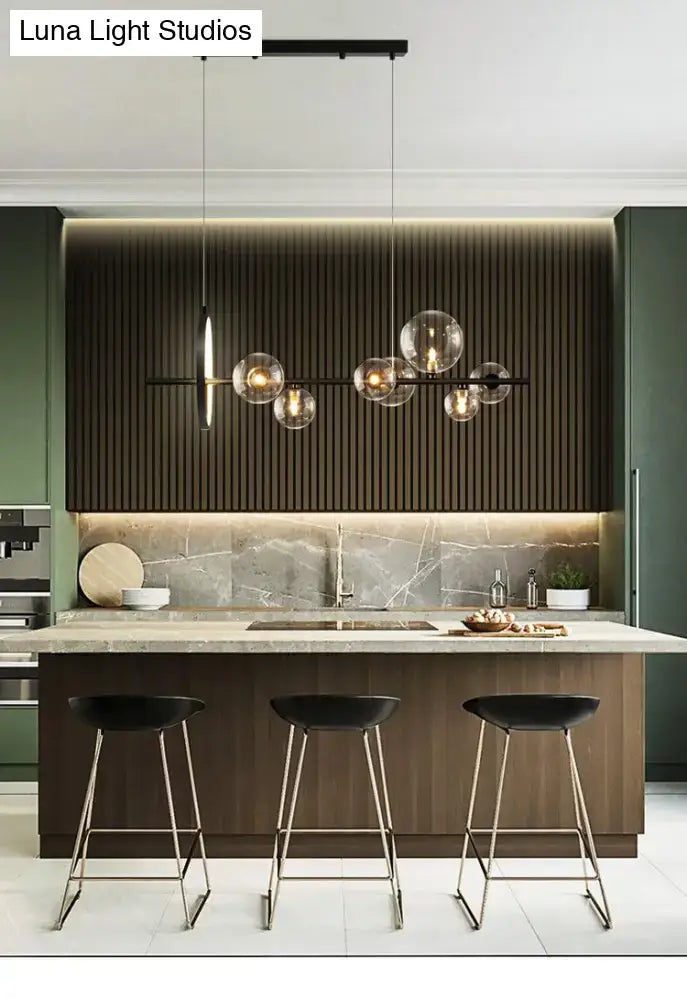 Modern black metal chandelier with clear glass globe bulbs for dining table featuring exposed bulb base light type