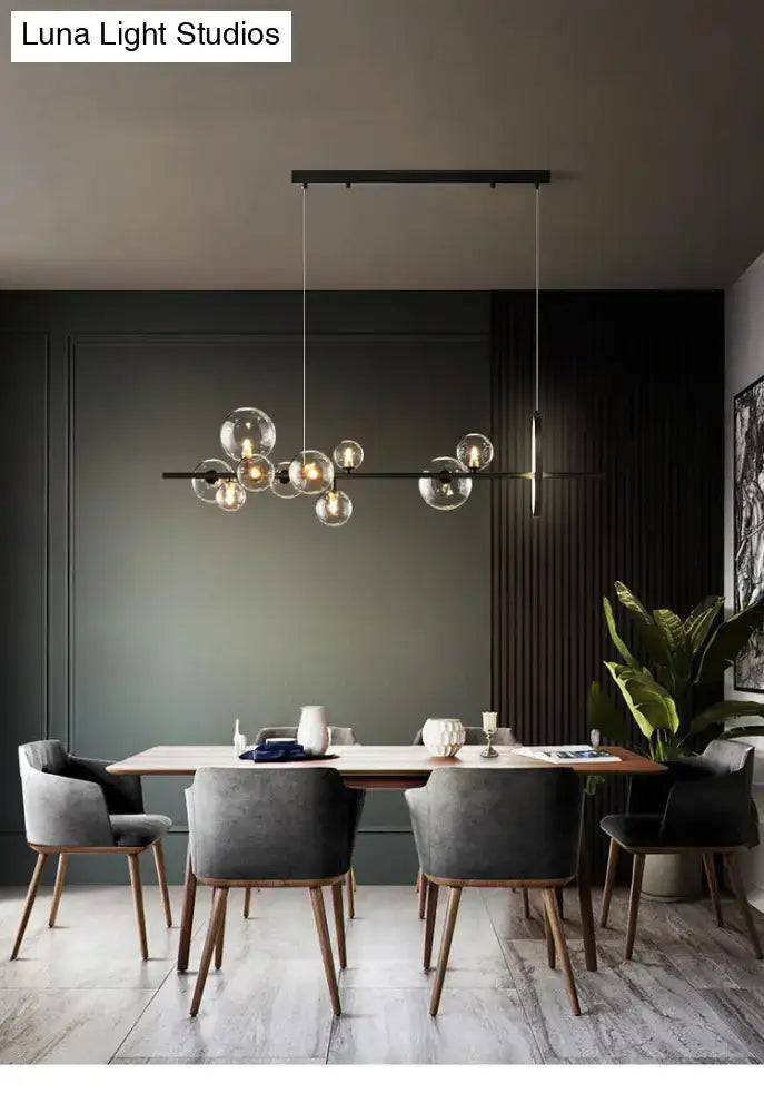 Modern black metal chandelier with clear glass globe bulbs featuring bulb base design for dining table light type