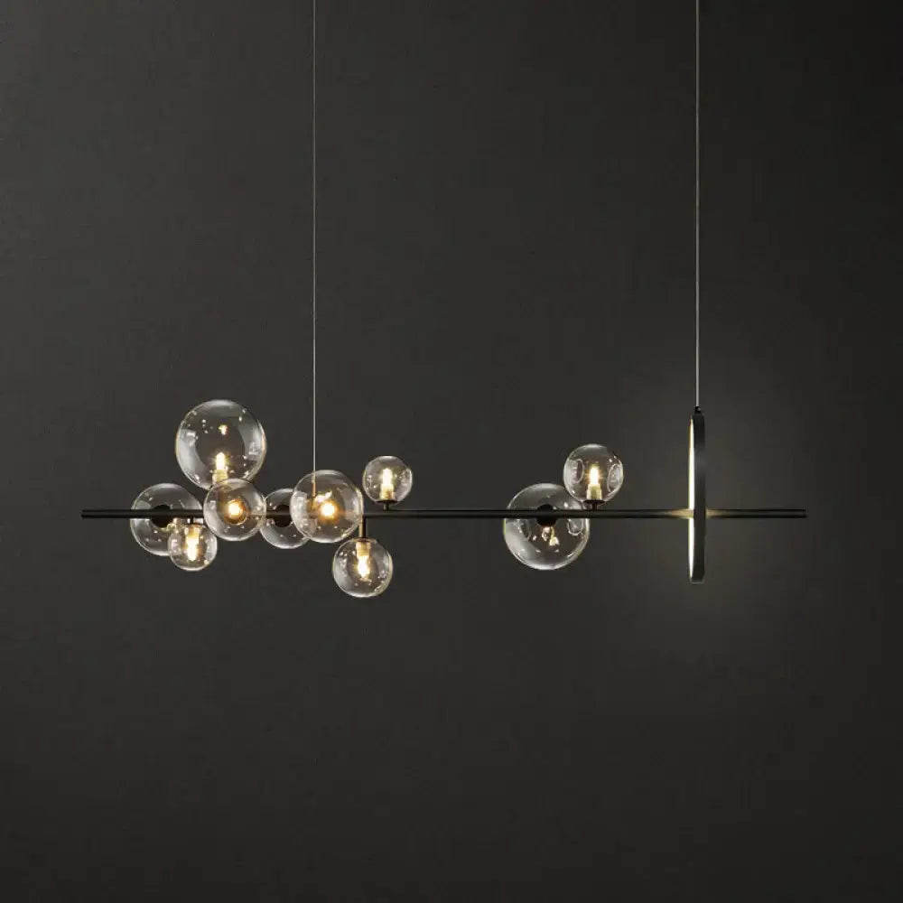 Modern black metal chandelier with clear glass globe bulbs and minimalist design for dining table lighting