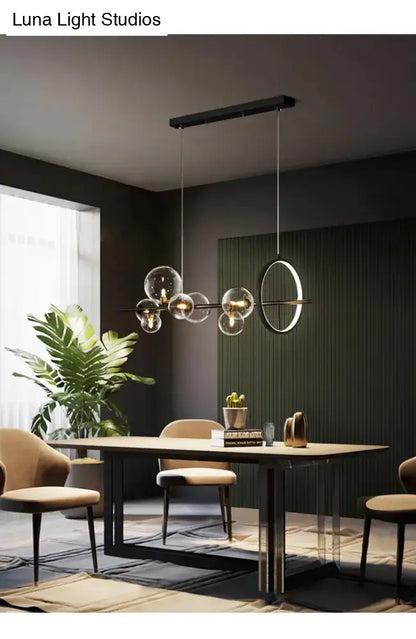 Modern black glass globe pendant light with spherical glass globes and circular ring for dining table bulb base lighting type