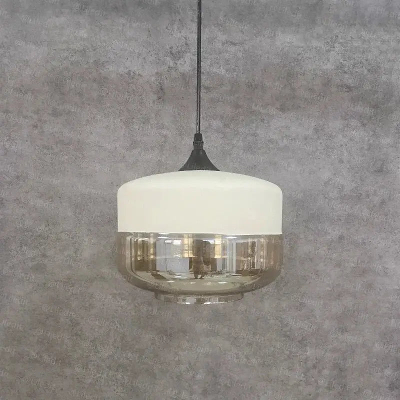 Modern black glass pendant light with frosted white top and textured smoked glass bowl for dining room decorbites black glass