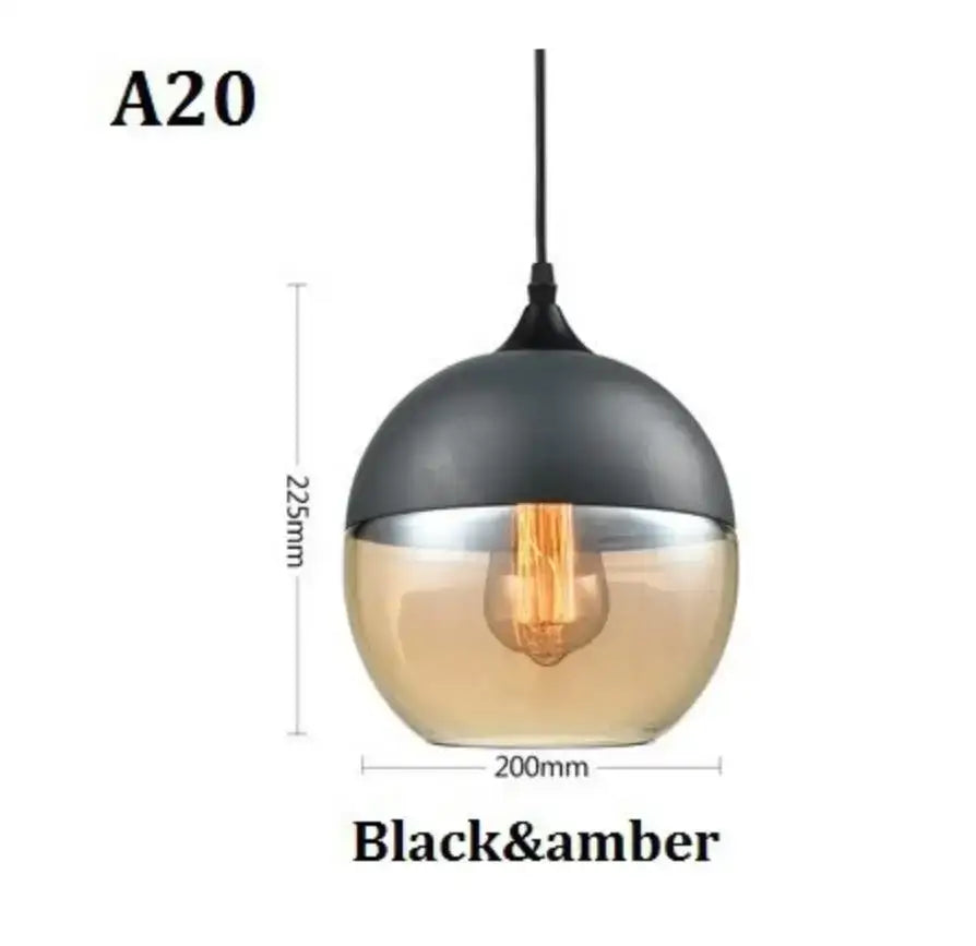 Modern black glass pendant light with two-toned matte black and amber glass shades for dining room decorbites black glass