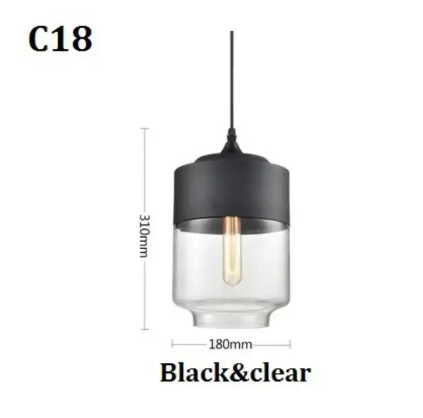 Modern black glass pendant light with cylindrical smoked glass body and exposed edison bulb for dining room decorbites black glass