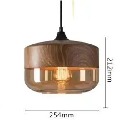 Modern black glass pendant light with warm amber glass shade wooden top and black hanging cord for dining room decorbites black glass