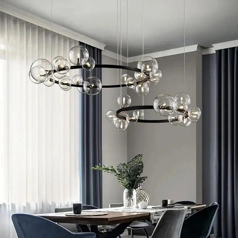 Modern black glass ring pendant light with clear glass globe bulbs in concentric circles for dining room decorbites black glass