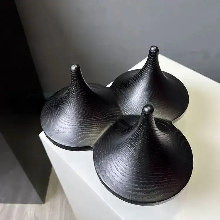 Modern black glossy ceramic decorbites geometric gyroscope sculpture with three interconnected conical forms for living room decor