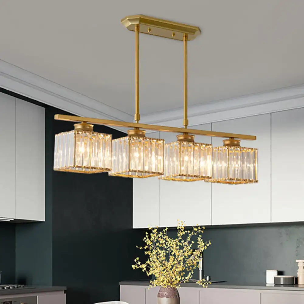 Gold-toned rectangular chandelier with four vertical crystal glass shades featuring e26 bulb base for 110v-120v use