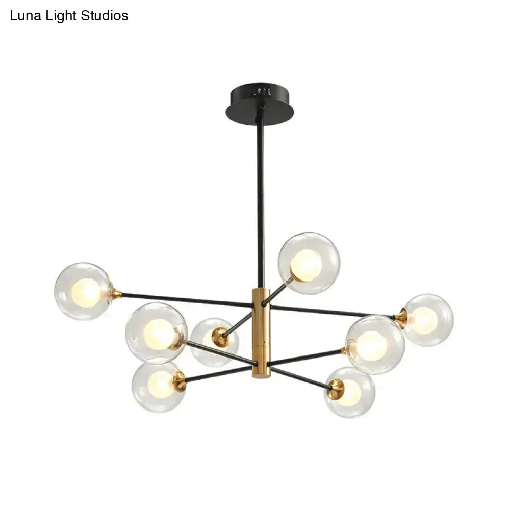 Modern black and brass DecorBites™ chandelier offers clear glass globe bulbs with an 8-light fixture width for living rooms