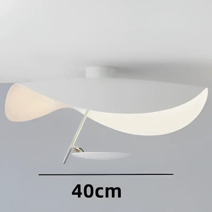 Modern black and gold abstract pendant light with sleek curved white acrylic shade and metallic support arm decorbites lederam manta