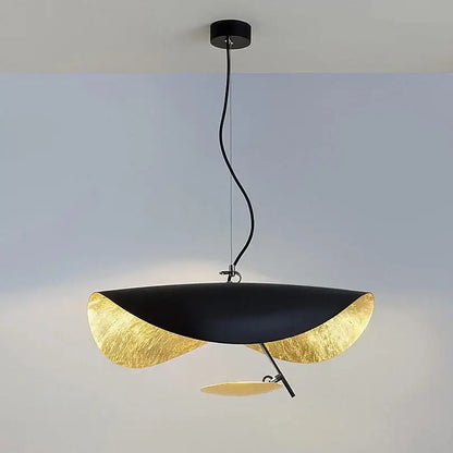 Modern black and gold abstract lederam manta pendant light with leaf-shaped design ideal for dining room decorbites lederam