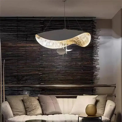 A modern black and gold decorbites lederam manta pendant light with a sleek metallic finish for dining room decor