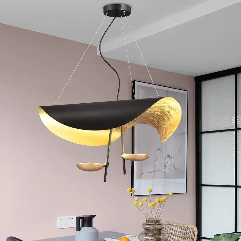 Modern black and gold abstract lederam manta pendant light with sculptural flowing design for dining room decorbites lederam