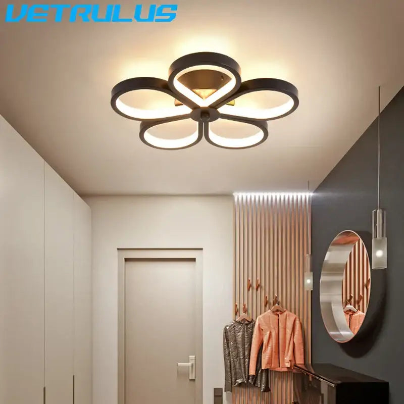 Modern black and gold acrylic flower twisted ceiling lamp with minimalist design for living room lighting