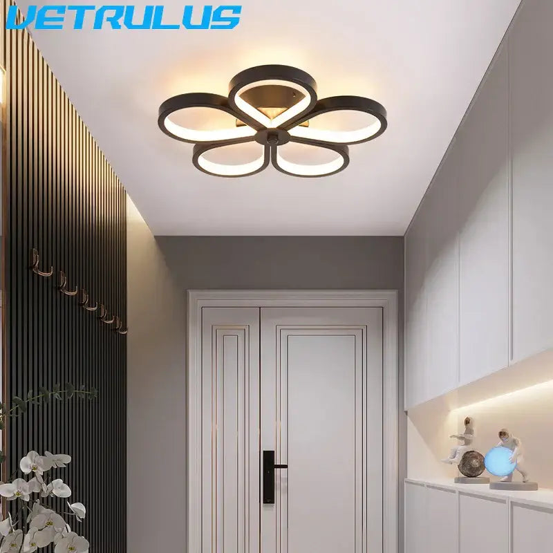 Modern black and gold acrylic flower twisted ceiling lamp with led lights ideal for living room illumination