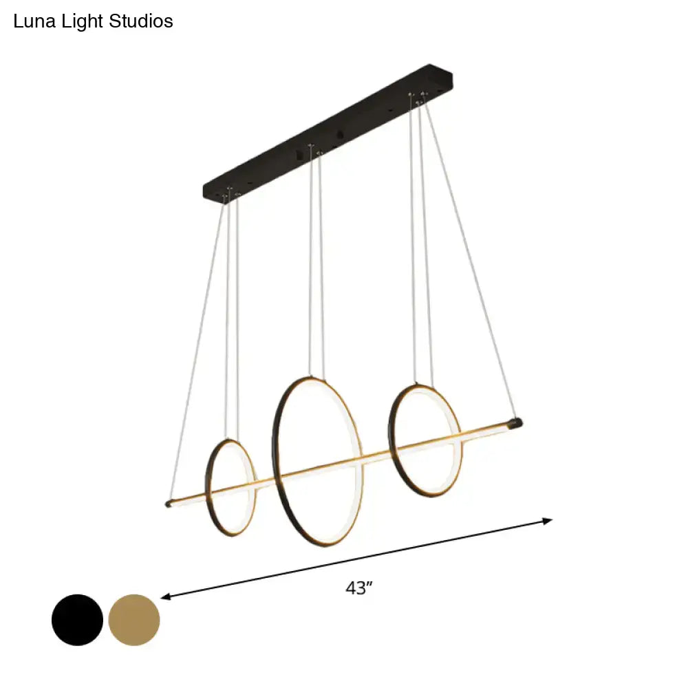 Modern black and gold acrylic linear suspension light with three-ring design for island pendant lighting use