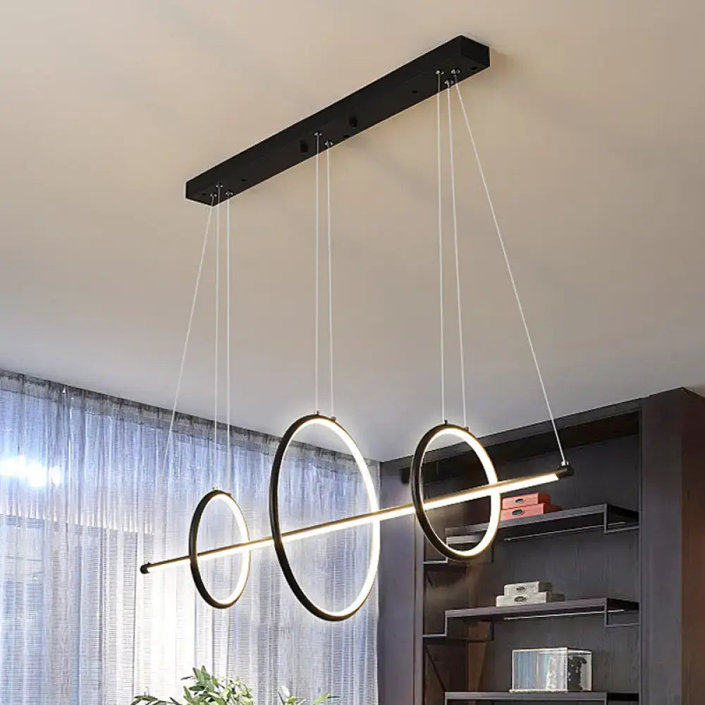 Modern black and white acrylic linear suspension light with 3-ring design and metallic rings for island pendant lighting