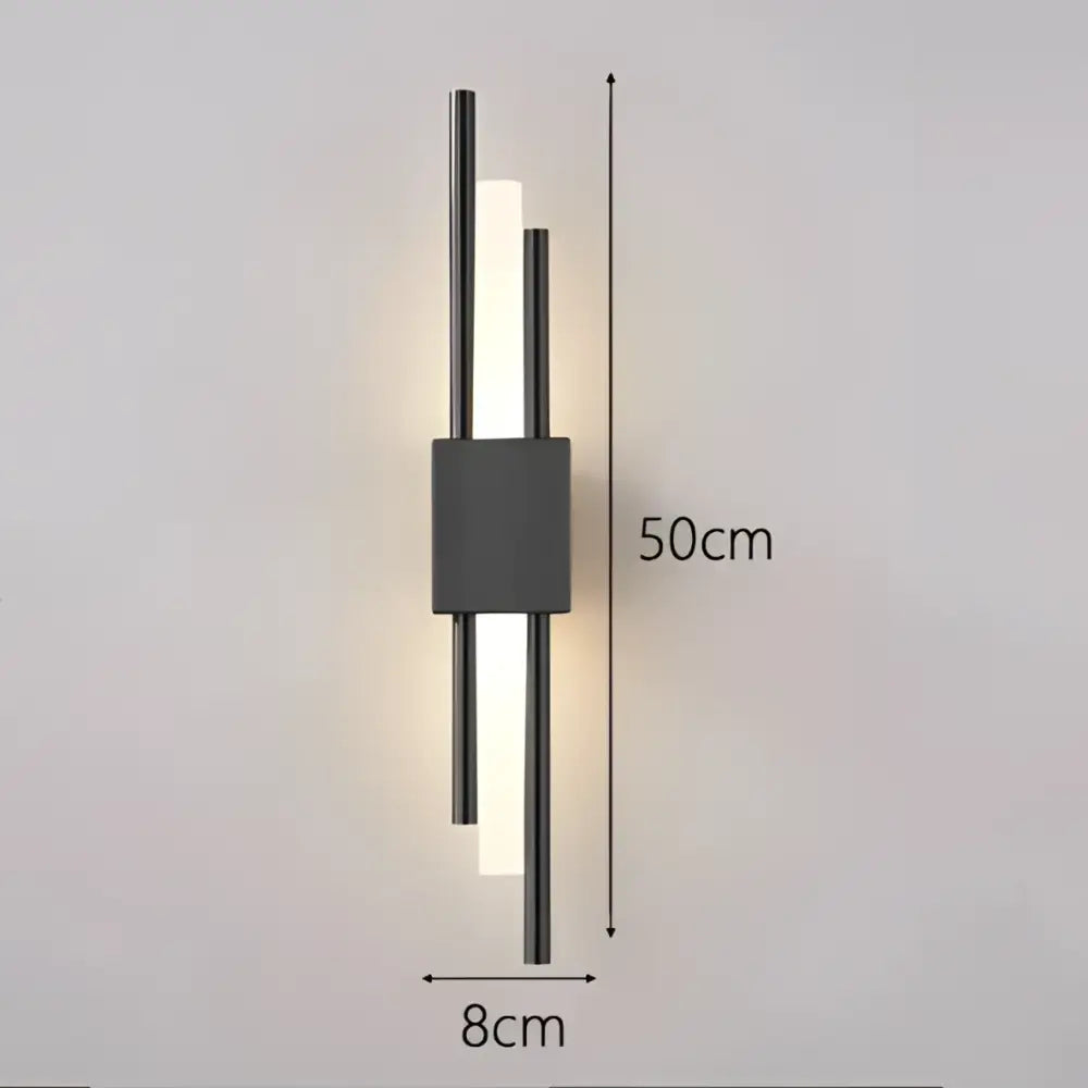 Modern black wall lamp with gold acrylic pipe features two vertical illuminated bars and a central rectangular accent