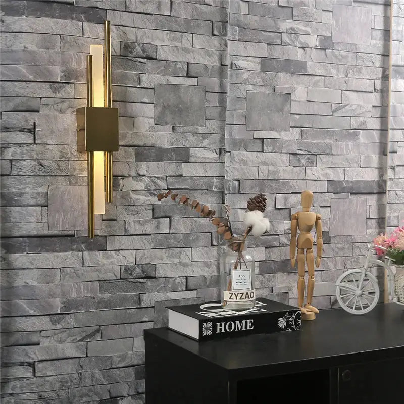 Gold-toned rectangular wall lamp with vertical acrylic pipe bars and square backplate for modern bedroom sconce