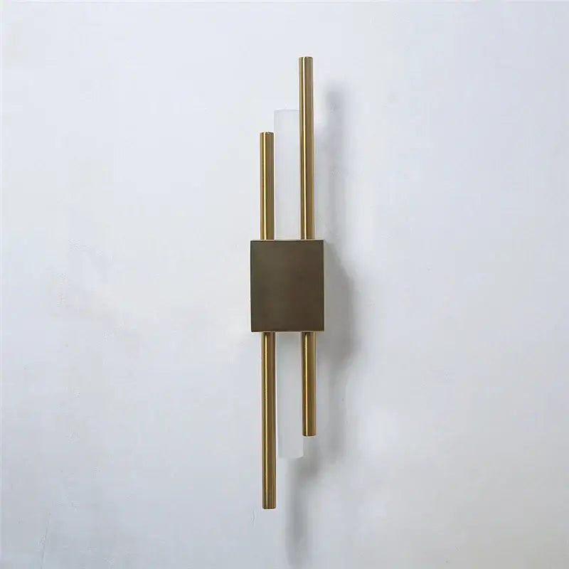Modern black and gold acrylic pipe wall lamp with gold-toned sconce, matte bronze square, and frosted glass accents