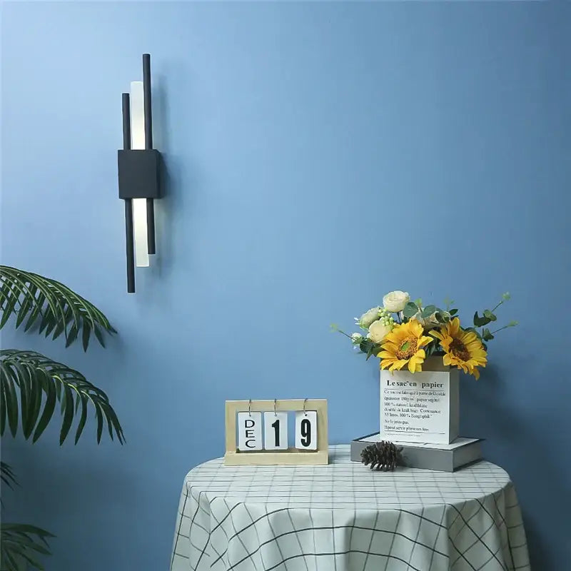 Modern black and white wall lamp with sleek vertical bars and gold acrylic pipe for bedroom acrylic pipe wall sconce