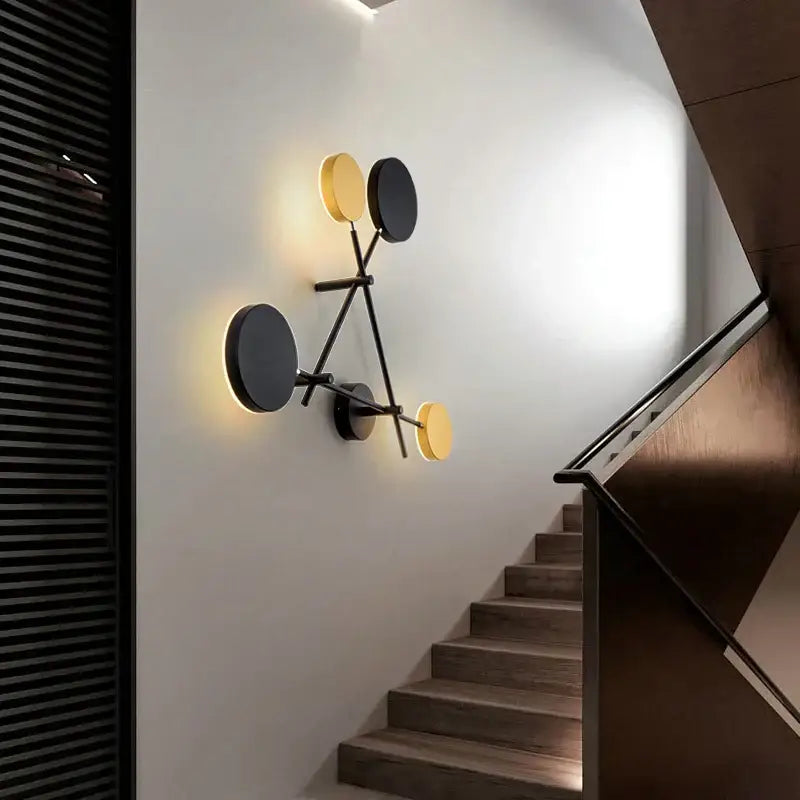 Modern black and gold decorbites adjustable rotating led wall sconce with black metal frame and circular light panels