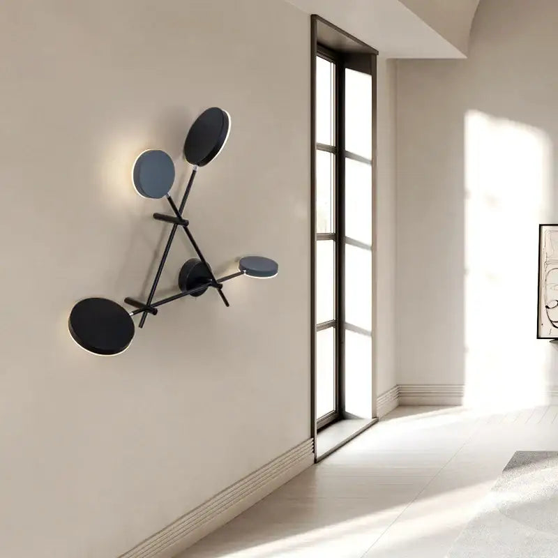 Modern black metal wall sconce with four matte shades featuring decorbites adjustable rotating led design for bedroom light