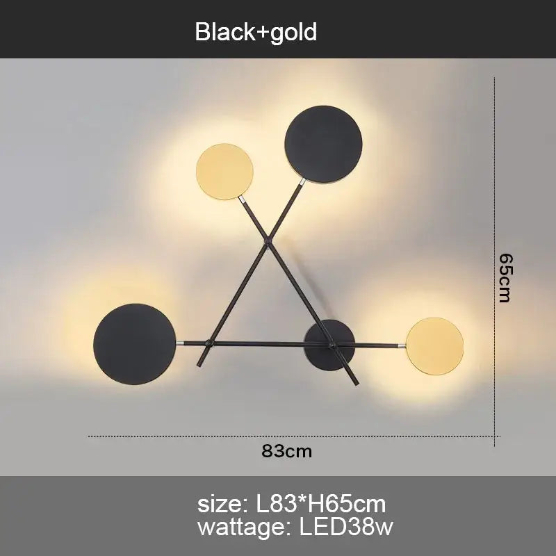 Modern black and gold wall sconce with decorbites adjustable rotating led circular fixtures in geometric pattern