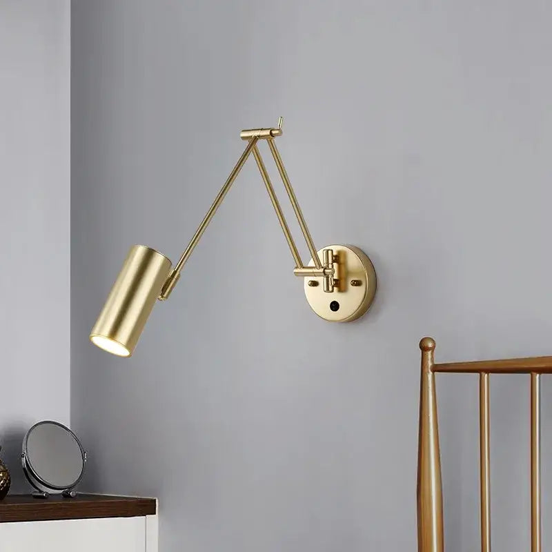 Modern black and gold wall lamp with decorbites adjustable swing arm and cylindrical gold-finished lamp head