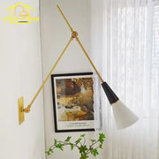 Modern black and gold adjustable wall lamp with gold-toned arm and black and white conical shade decorbites athena black