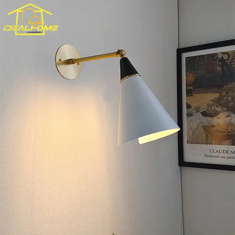 White conical wall lamp with black and gold accent and brass-finished arm by decorbites athena black kitchen sconce