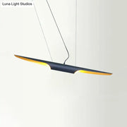 Decorbites modern island pendant lamp with bias cut tube design featuring matte black body and warm gold lining