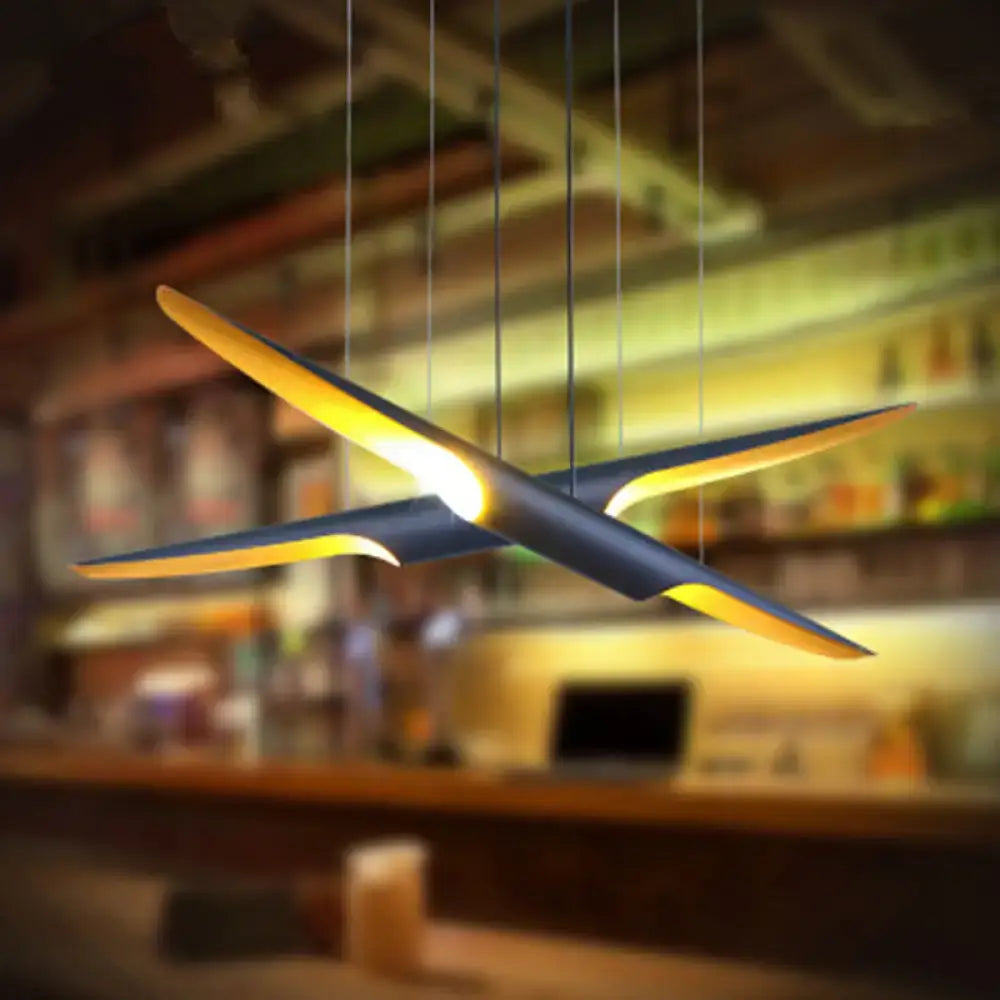Decorbites modern island pendant lamp with metallic shade in bias cut tube design features black and gold wings