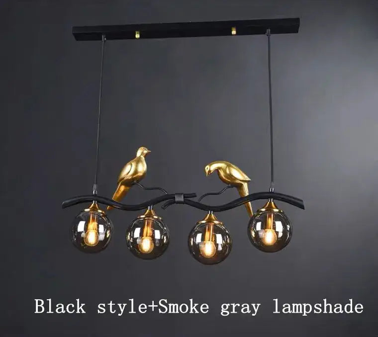 Modern black metal chandelier with gold bird sculptures holding smoke gray glass pendant lights for dining room
