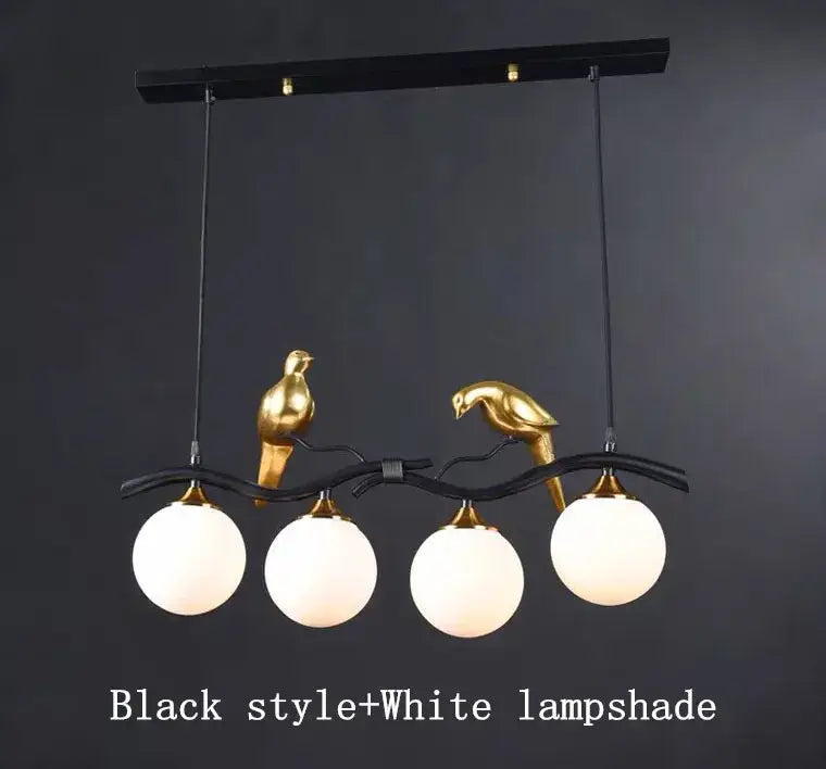 Modern black and gold bird glass pendant lights featuring two golden bird sculptures holding white glass lampshades